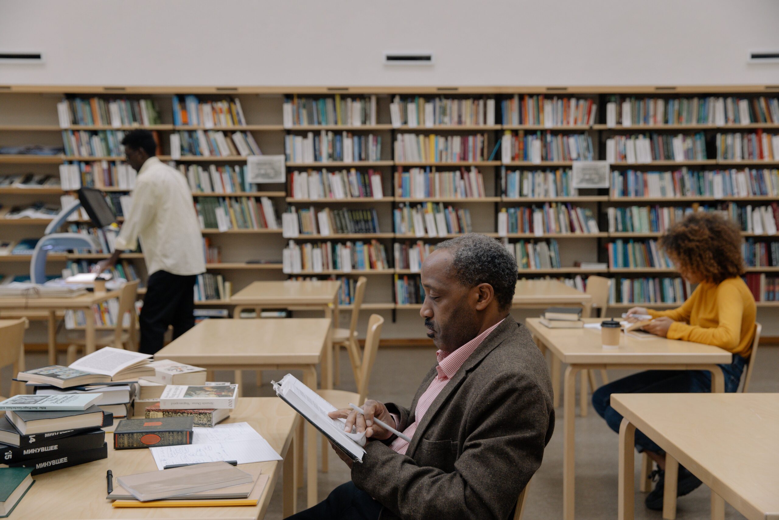 image of man studying in law library