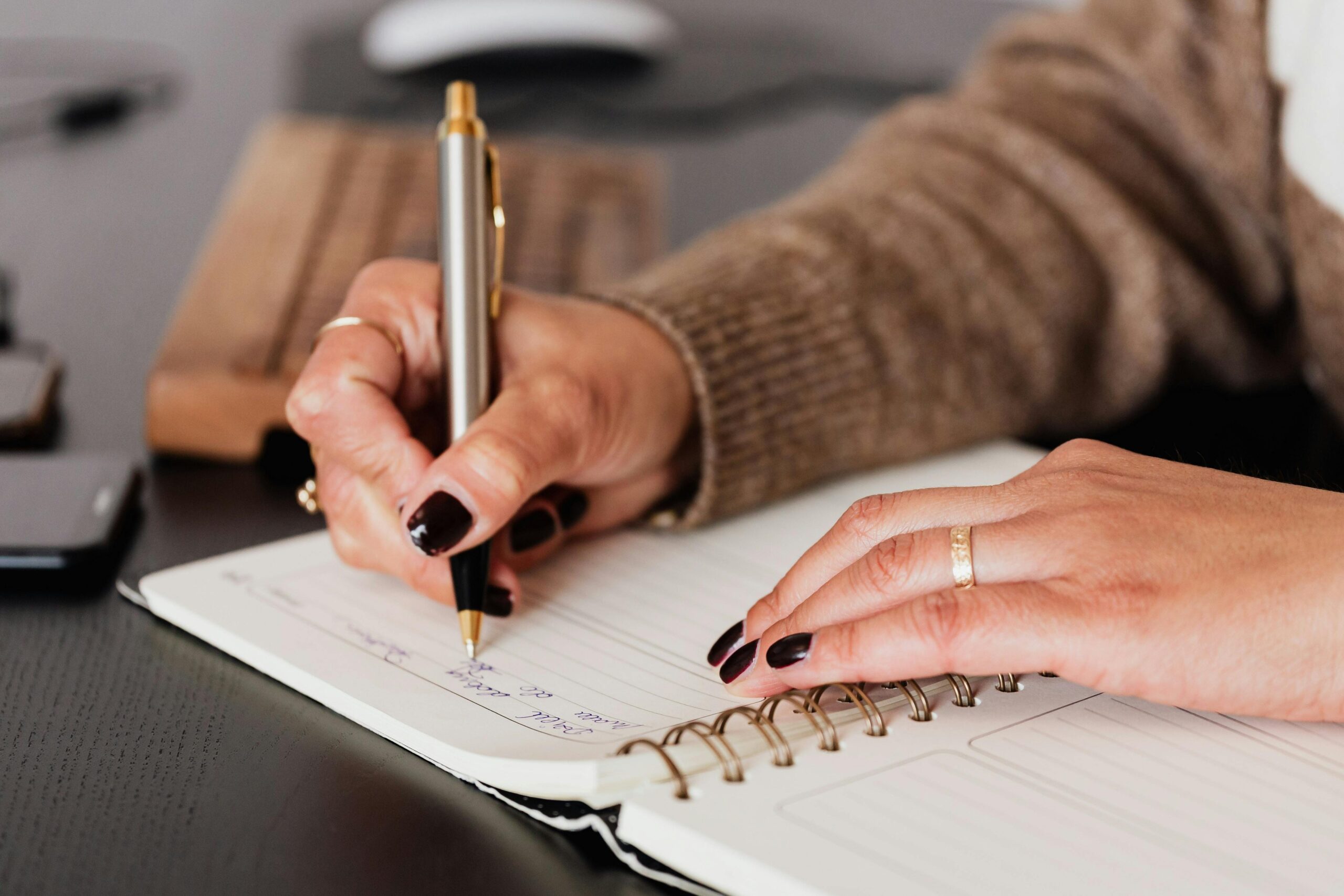 image of person writing in journal