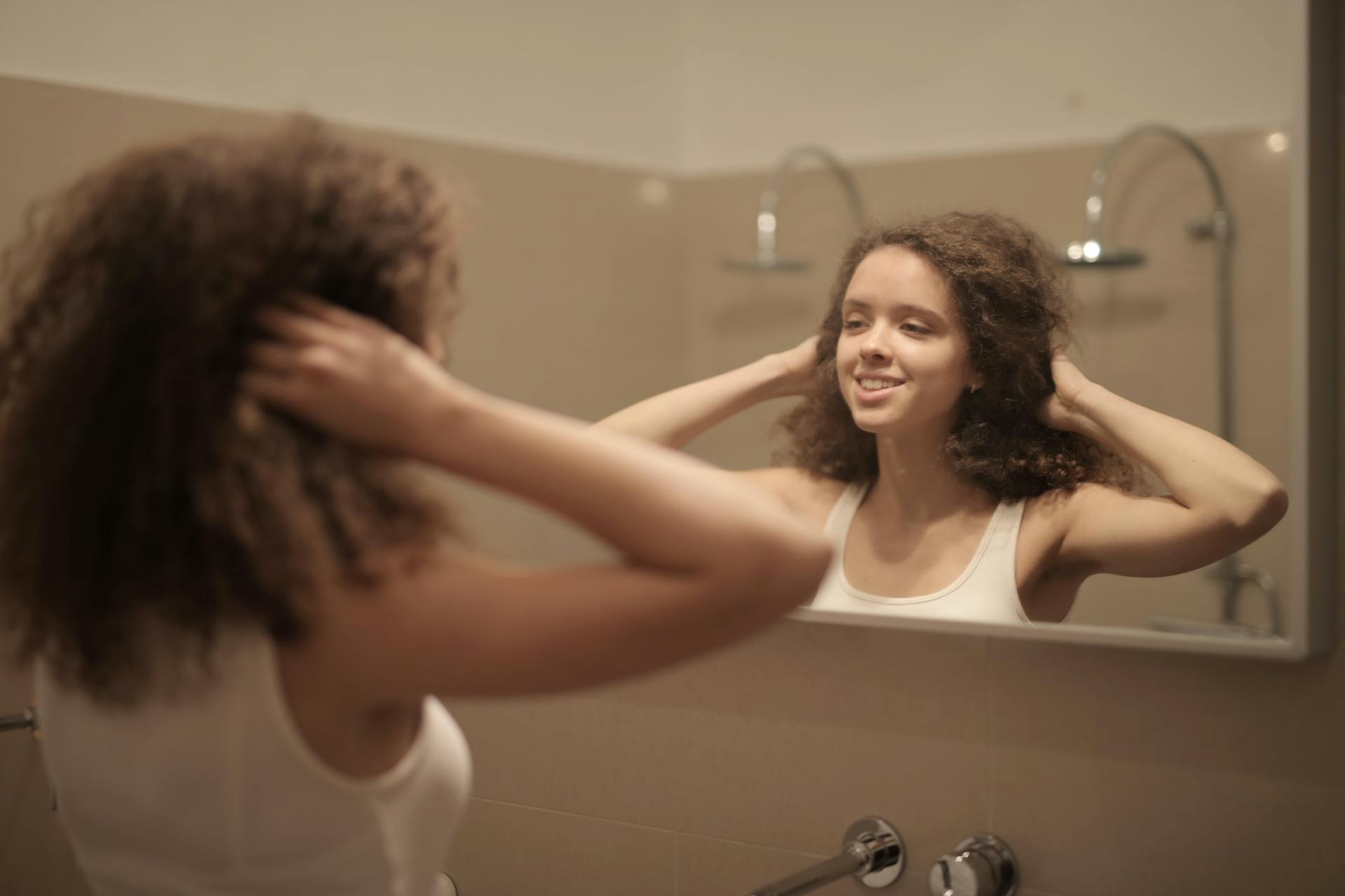image of woman smiling in mirror